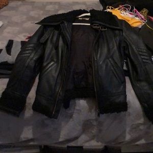 Leather jacket with fur around trim